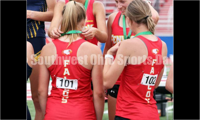Fenwick High School's girls 1,600-meter relay team of Sam Long, Stephanie Rose, Ashley Yontz and Mackenzie Rohde does some medal work on the podium May 25, 2024, during the Division II regional track & field meet at Piqua. RICK CASSANO/STAFF