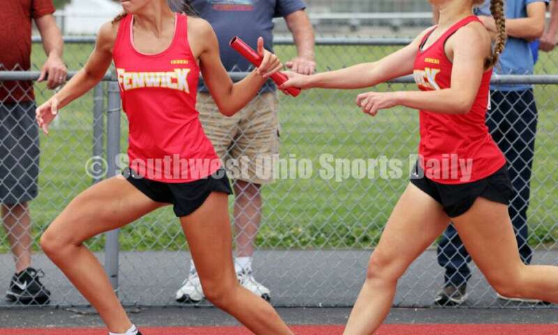 Fenwick High School's Stephanie Rose takes the baton from Ashley Yontz in the girls 1,600-meter relay May 25, 2024, during the Division II regional track & field meet at Piqua. RICK CASSANO/STAFF