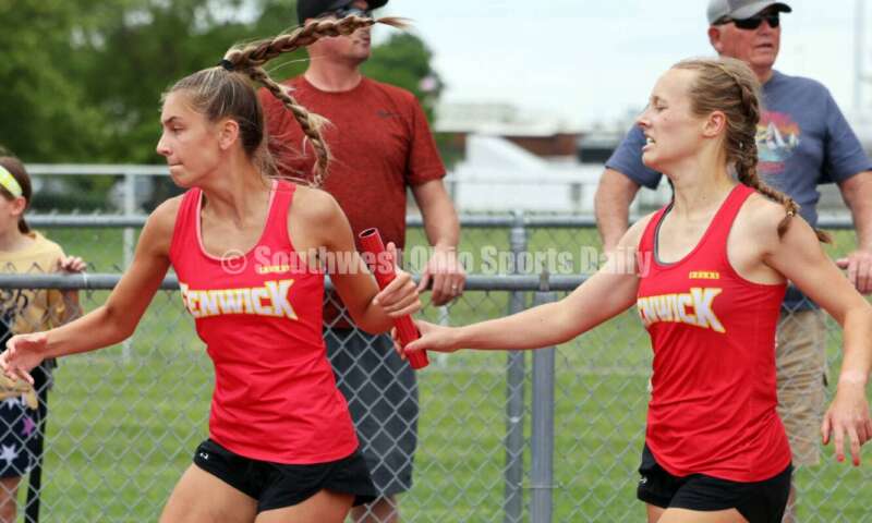 Fenwick High School's Ashley Yontz hands the baton to Stephanie Rose in the girls 1,600-meter relay May 25, 2024, during the Division II regional track & field meet at Piqua. RICK CASSANO/STAFF