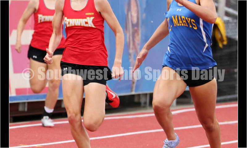 Fenwick High School's Mackenzie Rohde (left) battles St. Marys Memorial's Syerra Greber in the girls 400-meter dash May 25, 2024, during the Division II regional track & field meet at Piqua. RICK CASSANO/STAFF