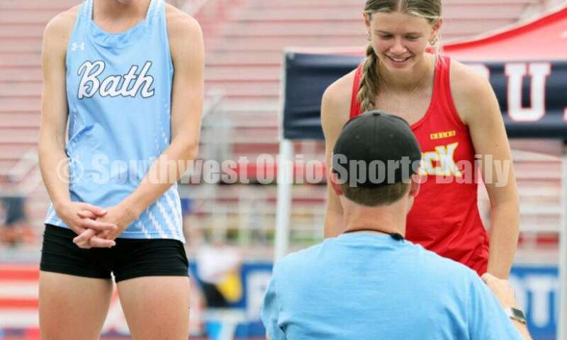 Fenwick High School's Mackenzie Rohde receives her medal after the girls 400-meter dash May 25, 2024, during the Division II regional track & field meet at Piqua. RICK CASSANO/STAFF