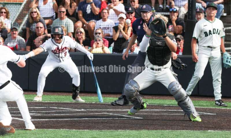 Badin High School catcher Kyle Anderson is about to tag Plain City Jonathan Alder's Andy Yoder out at the plate May 31, 2024, during a Division II regional championship baseball game at Mason. Badin won 2-0. RON ALVEY/CONTRIBUTOR