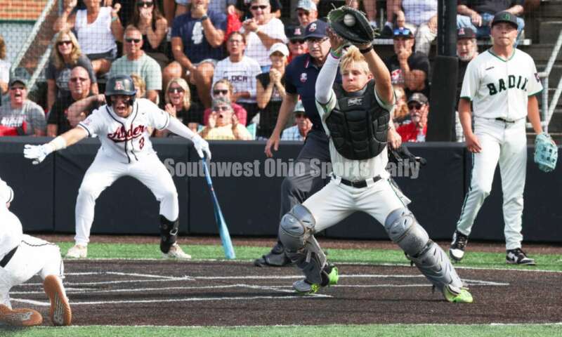 Badin High School catcher Kyle Anderson is about to tag Plain City Jonathan Alder's Andy Yoder out at the plate May 31, 2024, during a Division II regional championship baseball game at Mason. Badin won 2-0. RON ALVEY/CONTRIBUTOR