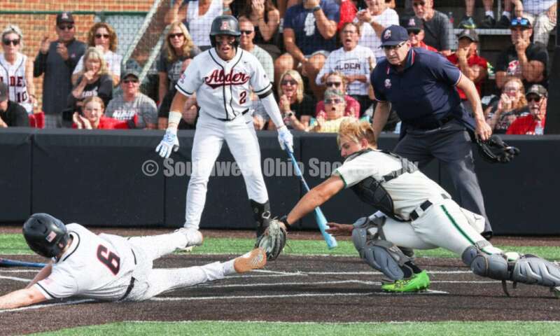 Badin High School catcher Kyle Anderson tags Plain City Jonathan Alder's Andy Yoder out at the plate May 31, 2024, during a Division II regional championship baseball game at Mason. Badin won 2-0. RON ALVEY/CONTRIBUTOR