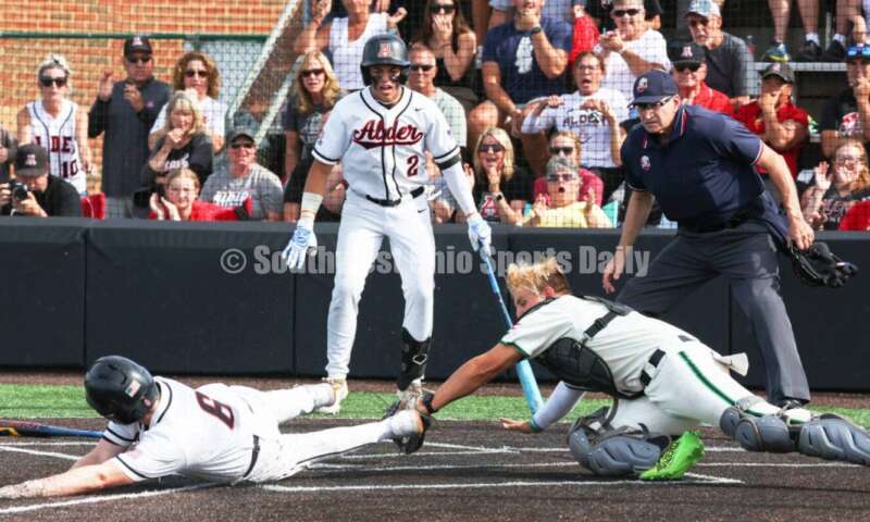 Badin High School catcher Kyle Anderson tags Plain City Jonathan Alder's Andy Yoder out at the plate May 31, 2024, during a Division II regional championship baseball game at Mason. Badin won 2-0. RON ALVEY/CONTRIBUTOR