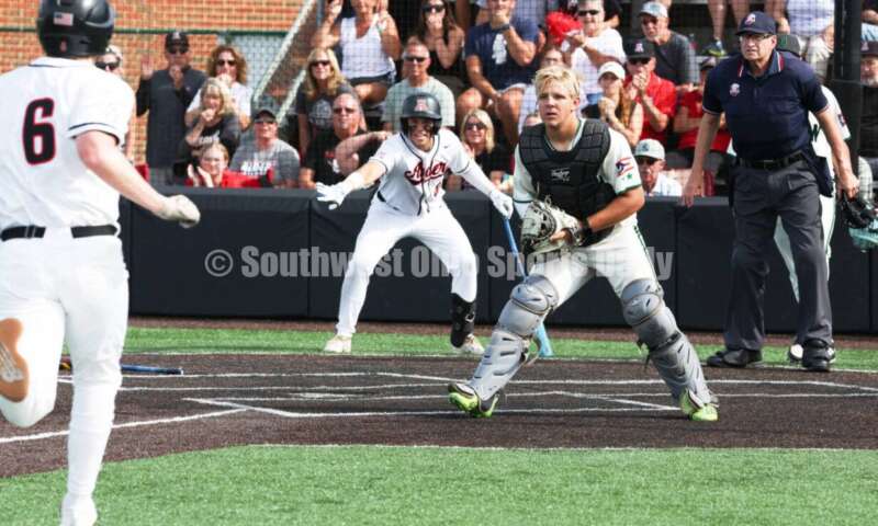 Badin High School catcher Kyle Anderson is about to tag Plain City Jonathan Alder's Andy Yoder out at the plate May 31, 2024, during a Division II regional championship baseball game at Mason. Badin won 2-0. RON ALVEY/CONTRIBUTOR