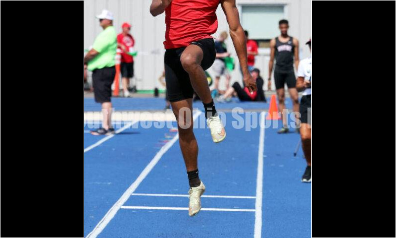Franklin High School's Josh Carter flies through the air in the Division I boys long jump June 1, 2024, during the state track & field meet at Welcome Stadium in Dayton. Carter placed ninth. RICK CASSANO/STAFF