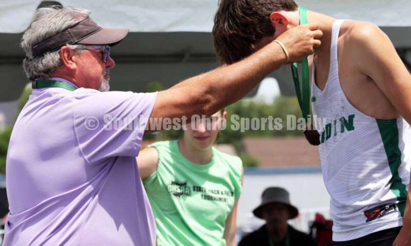 Badin High School's Nick Dunn receives his medal after the Division II boys 3,200-meter run June 1, 2024, during the state track & field meet at Welcome Stadium in Dayton. Dunn placed eighth. RICK CASSANO/STAFF