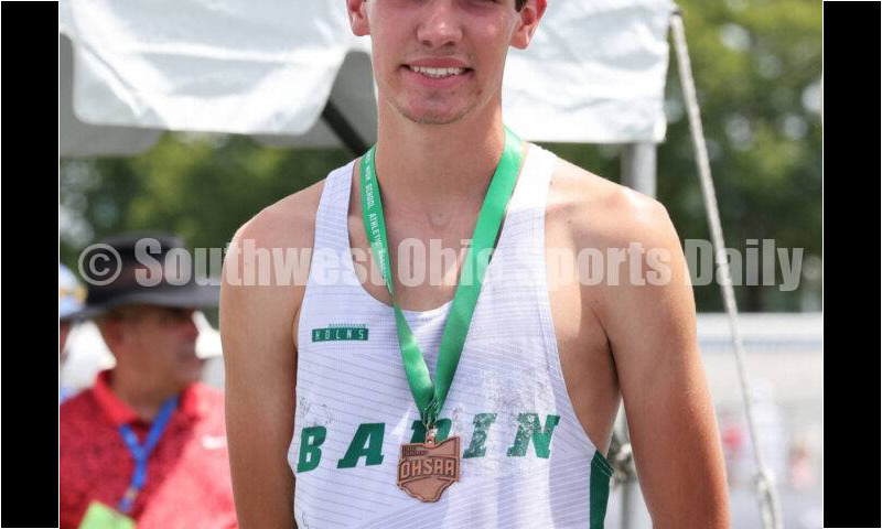 Badin High School's Nick Dunn stands on the podium after the Division II boys 3,200-meter run June 1, 2024, during the state track & field meet at Welcome Stadium in Dayton. Dunn placed eighth. RICK CASSANO/STAFF