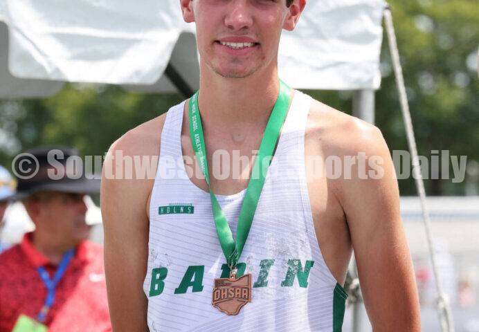 Badin High School's Nick Dunn stands on the podium after the Division II boys 3,200-meter run June 1, 2024, during the state track & field meet at Welcome Stadium in Dayton. Dunn placed eighth. RICK CASSANO/STAFF
