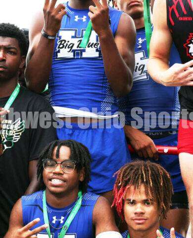 Hamilton High School's (clockwise from bottom left) Landyn Pope, Noah King, R.J. Shepherd and Javon McClain celebrate on the podium after the Division I boys 400-meter relay June 1, 2024, during the state track & field meet at Welcome Stadium in Dayton. HHS placed second. RICK CASSANO/STAFF