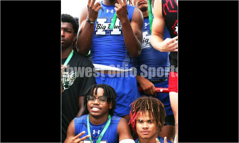 Hamilton High School's (clockwise from bottom left) Landyn Pope, Noah King, R.J. Shepherd and Javon McClain celebrate on the podium after the Division I boys 400-meter relay June 1, 2024, during the state track & field meet at Welcome Stadium in Dayton. HHS placed second. RICK CASSANO/STAFF