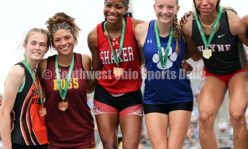 From left, Mount Vernon's Marissa Rutter, Ross' Myah Boze, Shaker Heights' Jennifer Rawls, Hilliard Davidson's Anna Wile and Huber Heights Wayne's Ric'Keya White pose on the podium after the Division I girls 100-meter hurdles June 1, 2024, during the state track & field meet at Welcome Stadium in Dayton. Boze placed seventh. RICK CASSANO/STAFF