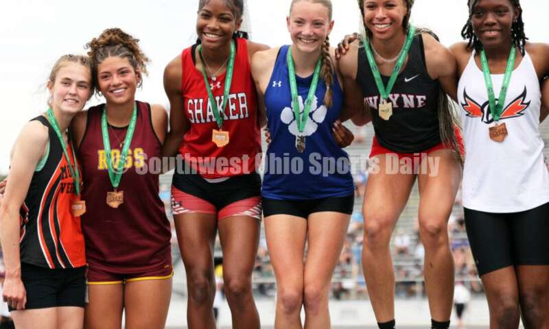 From left, Mount Vernon's Marissa Rutter, Ross' Myah Boze, Shaker Heights' Jennifer Rawls, Hilliard Davidson's Anna Wile, Huber Heights Wayne's Ric'Keya White and Beavercreek's Faith Brown pose on the podium after the Division I girls 100-meter hurdles June 1, 2024, during the state track & field meet at Welcome Stadium in Dayton. Boze placed seventh. RICK CASSANO/STAFF