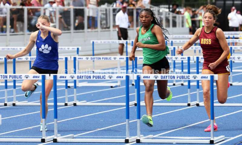 Ross High School's Myah Boze runs against Hilliard Davidson's Anna Wile (far left) and Dublin Coffman's Nadiya Webb in the Division I girls 100-meter hurdles June 1, 2024, during the state track & field meet at Welcome Stadium in Dayton. Boze placed seventh. RICK CASSANO/STAFF