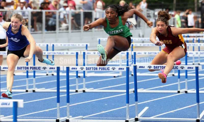 Ross High School's Myah Boze runs with Hilliard Davidson's Anna Wile (far left) and Dublin Coffman's Nadiya Webb in the Division I girls 100-meter hurdles June 1, 2024, during the state track & field meet at Welcome Stadium in Dayton. Boze placed seventh. RICK CASSANO/STAFF