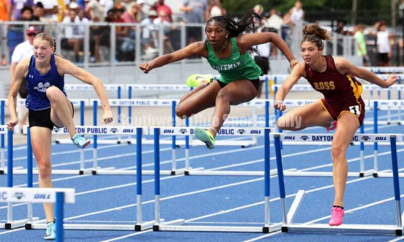 Ross High School's Myah Boze runs with Hilliard Davidson's Anna Wile (far left) and Dublin Coffman's Nadiya Webb in the Division I girls 100-meter hurdles June 1, 2024, during the state track & field meet at Welcome Stadium in Dayton. Boze placed seventh. RICK CASSANO/STAFF