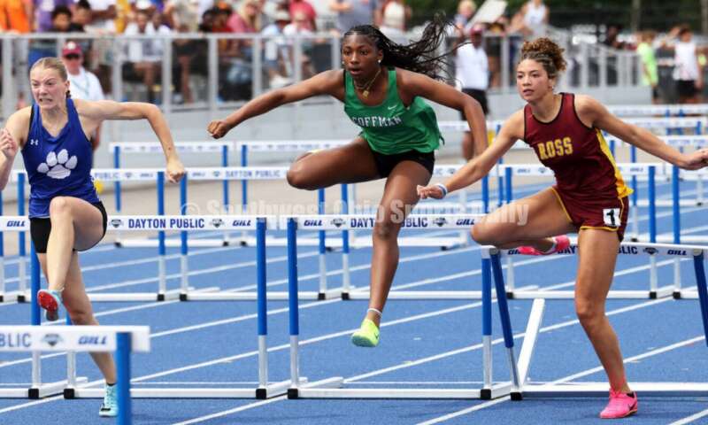 Ross High School's Myah Boze runs with Hilliard Davidson's Anna Wile (far left) and Dublin Coffman's Nadiya Webb in the Division I girls 100-meter hurdles June 1, 2024, during the state track & field meet at Welcome Stadium in Dayton. Boze placed seventh. RICK CASSANO/STAFF