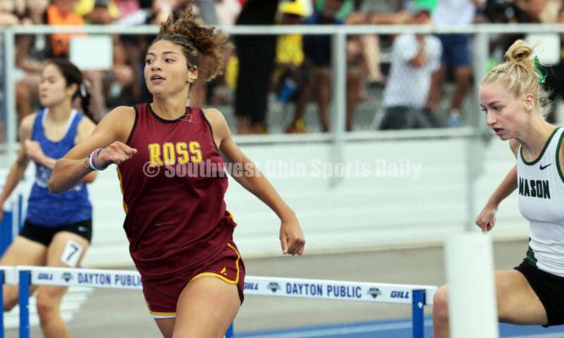 Ross High School's Myah Boze (left) runs past Mason's Lily Eagleston in the Division I girls 300-meter hurdles June 1, 2024, during the state track & field meet at Welcome Stadium in Dayton. Boze placed third. RICK CASSANO/STAFF