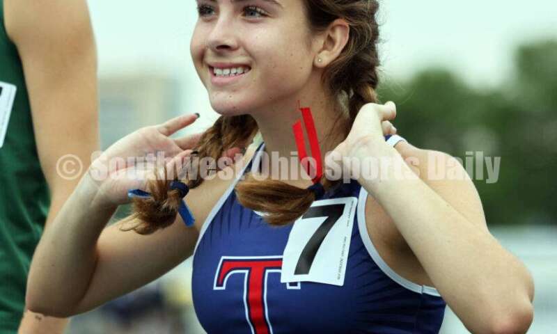 Talawanda High School's Lucia Rodbro reacts on the podium after finishing seventh in the Division I girls 3,200-meter run June 1, 2024, at the state track & field meet at Welcome Stadium in Dayton. RICK CASSANO/STAFF