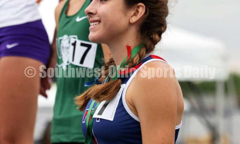 Talawanda High School's Lucia Rodbro stands on the podium after finishing seventh in the Division I girls 3,200-meter run June 1, 2024, at the state track & field meet at Welcome Stadium in Dayton. RICK CASSANO/STAFF