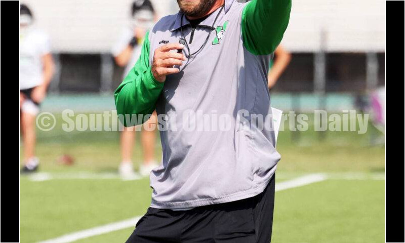 Harrison High School coach Derek Rehage gives instructions Aug. 14, 2024, during a football practice at the school in Harrison. RICK CASSANO/STAFF
