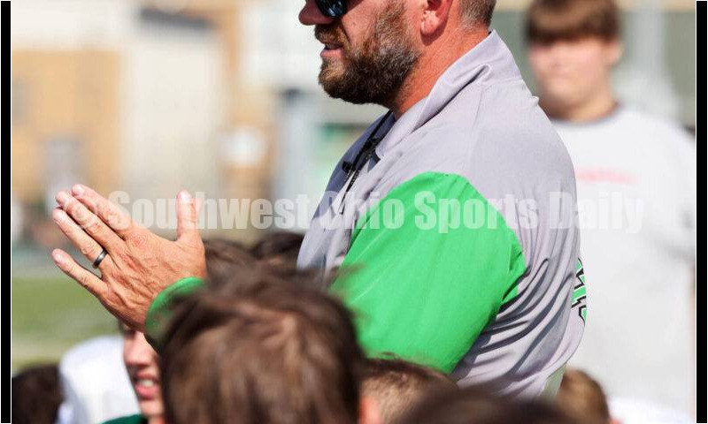 Harrison High School coach Derek Rehage talks to his team Aug. 14, 2024, after a football practice at the school in Harrison. RICK CASSANO/STAFF