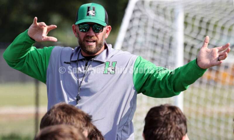 Harrison High School coach Derek Rehage talks to his team Aug. 14, 2024, after a football practice at the school in Harrison. RICK CASSANO/STAFF