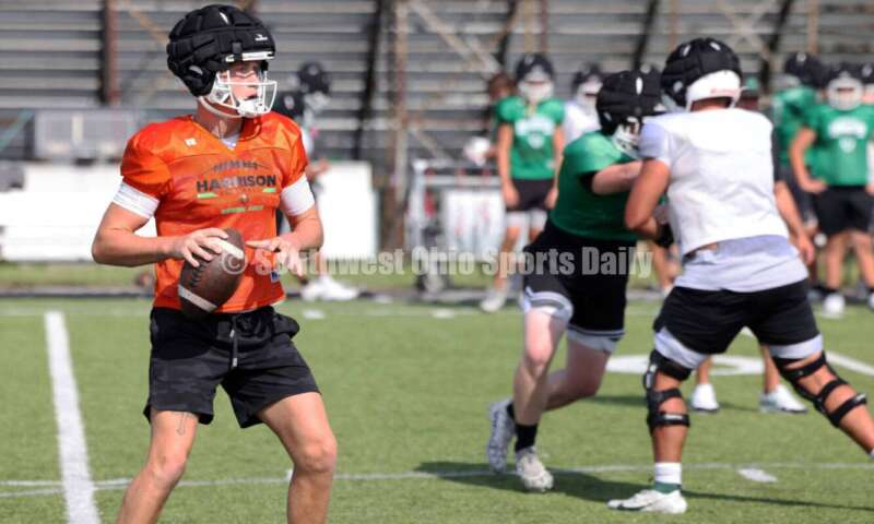 Harrison High School quarterback Dickie Engel looks for an open receiver Aug. 14, 2024, during a football practice at the school in Harrison. RICK CASSANO/STAFF