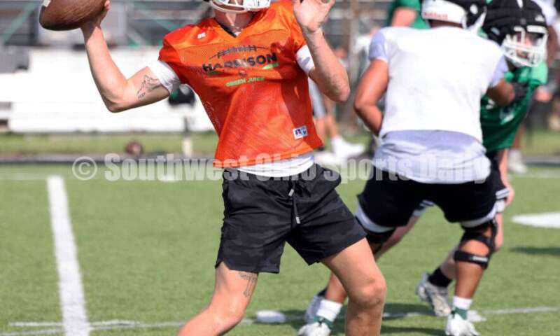 Harrison High School quarterback Dickie Engel drops back to pass Aug 14, 2024, during a football practice at the school in Harrison. RICK CASSANO/STAFF