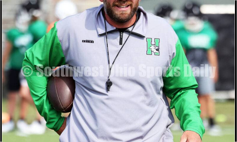 Harrison High School coach Derek Rehage prepares for a play Aug. 14, 2024, during a football practice at the school in Harrison. RICK CASSANO/STAFF