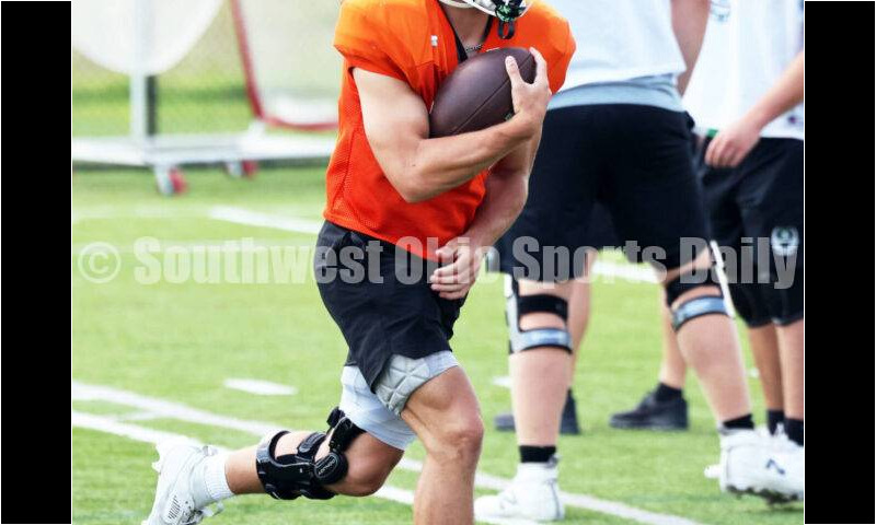 Harrison High School's Preston Flick runs with the ball Aug. 7, 2025, during a football practice at the school in Harrison. RICK CASSANO/STAFF