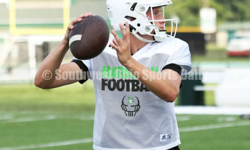 Harrison High School quarterback Brady Lawhon drops back to pass Aug. 7, 2025, during a football practice at the school in Harrison. RICK CASSANO/STAFF