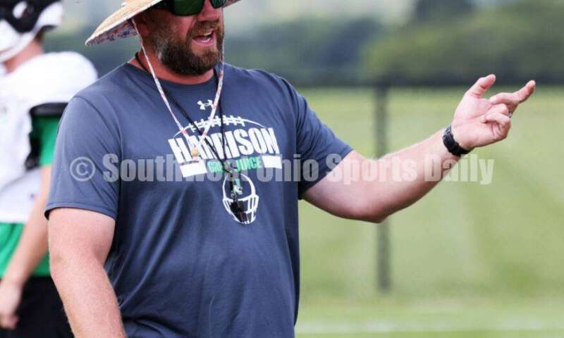 Harrison High School coach Derek Rehage gives instructions Aug. 7, 2025, during a football practice at the school in Harrison. RICK CASSANO/STAFF