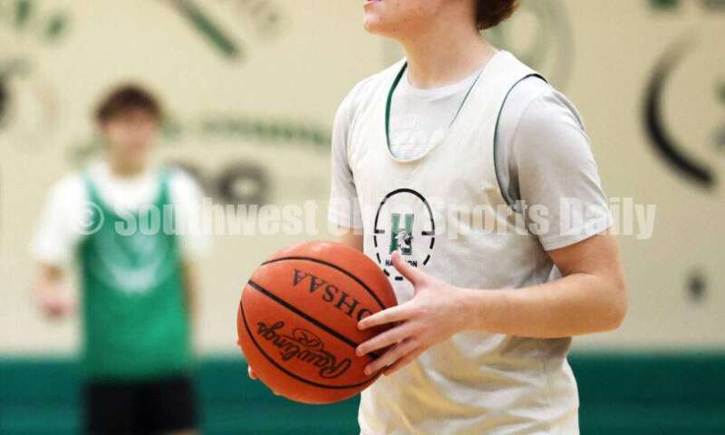 Harrison High School's Ryan Stigler maneuvers with the ball Nov. 25, 2025, during a boys basketball practice in Harrison. RICK CASSANO/STAFF
