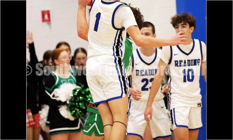 Reading High School's Marc Smith pressures Harrison's Mitchell Mercurio on a drive Dec. 8, 2025, during a boys basketball game at Reading. Harrison won 62-42. RICK CASSANO/STAFF