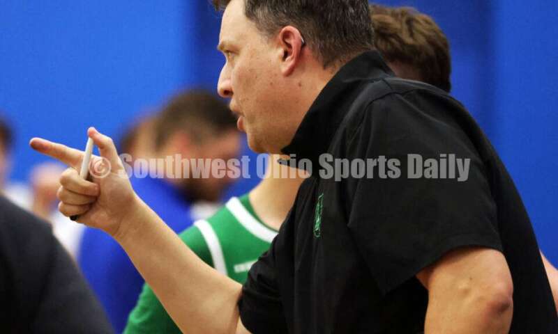 Harrison High School coach Andy Marx talks in a huddle Dec. 8, 2025, during a boys basketball game at Reading. Harrison won 62-42. RICK CASSANO/STAFF