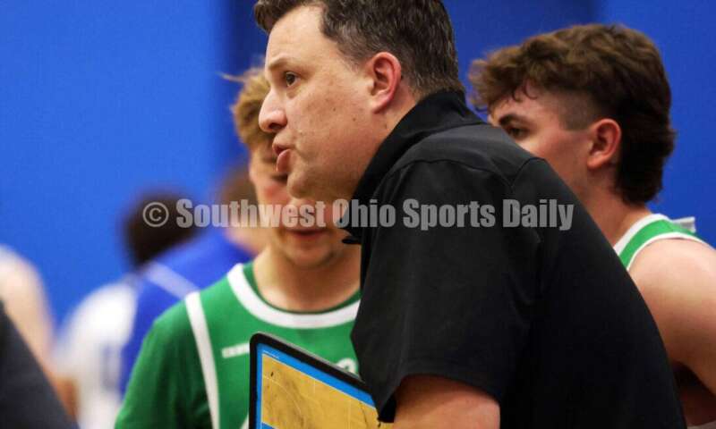 Harrison High School coach Andy Marx talks in a huddle Dec. 8, 2025, during a boys basketball game at Reading. Harrison won 62-42. RICK CASSANO/STAFF