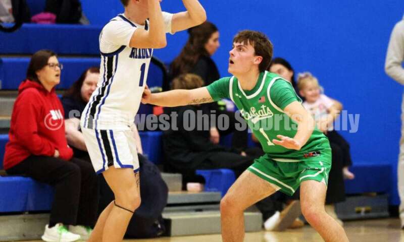 Harrison High School's Mitchell Mercurio defends Reading's Marc Smith on Dec. 8, 2025, during a boys basketball game at Reading. Harrison won 62-42. RICK CASSANO/STAFF