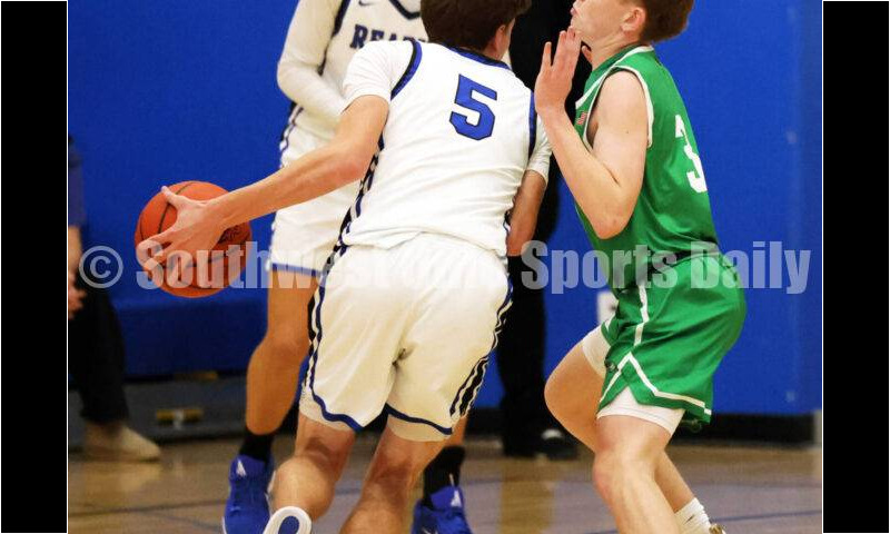 Harrison High School's Derek Stigler defends Reading's Ryan VonderMeulen (5) on Dec. 8, 2025, during a boys basketball game at Reading. Harrison won 62-42. RICK CASSANO/STAFF