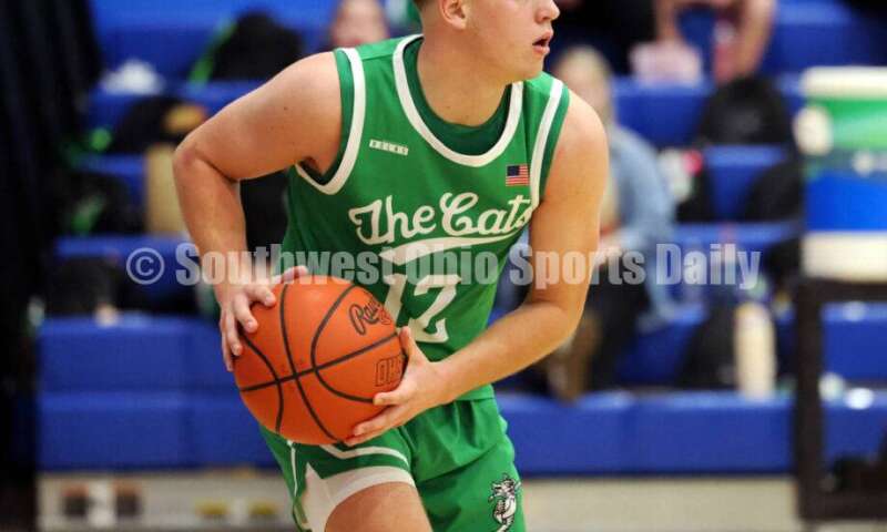 Harrison High School's Tucker Ward looks to make a pass Dec. 8, 2025, during a boys basketball game at Reading. Harrison won 62-42. RICK CASSANO/STAFF