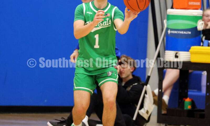 Harrison High School's Mitchell Mercurio makes a pass Dec. 8, 2025, during a boys basketball game at Reading. Harrison won 62-42. RICK CASSANO/STAFF